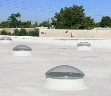 Several NL flat roof tubular skylights installed on foam roof thumb